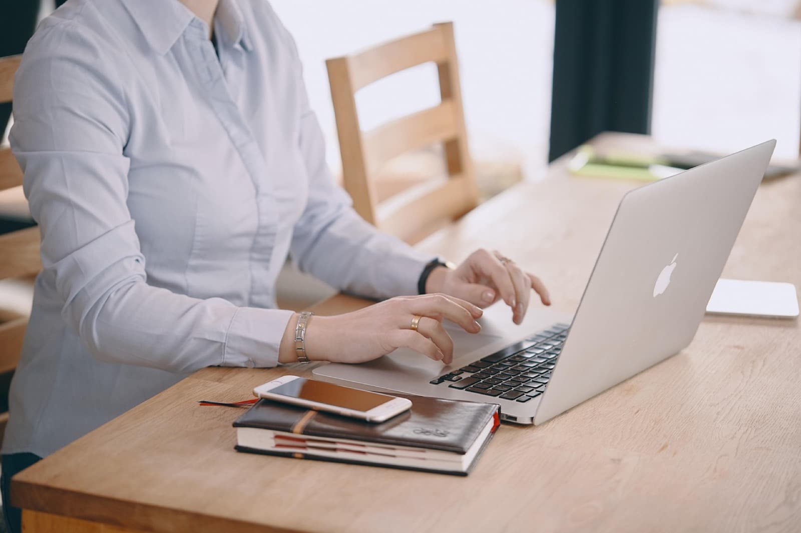 Professional managing payroll and tax work at her computer